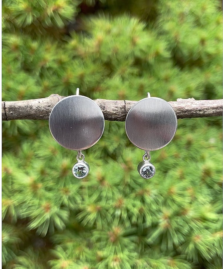 Light denim blue Montana sapphire sterling silver disc earrings.