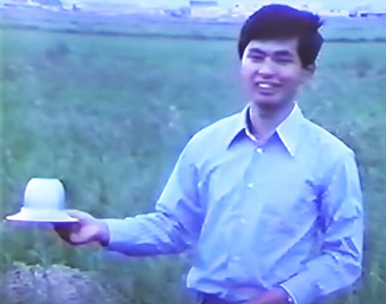 This photo is a still-frame grab from a Japanese TV documentary on the incident, probably showing Michio Seo holding a replica of the object at the site of the first contact