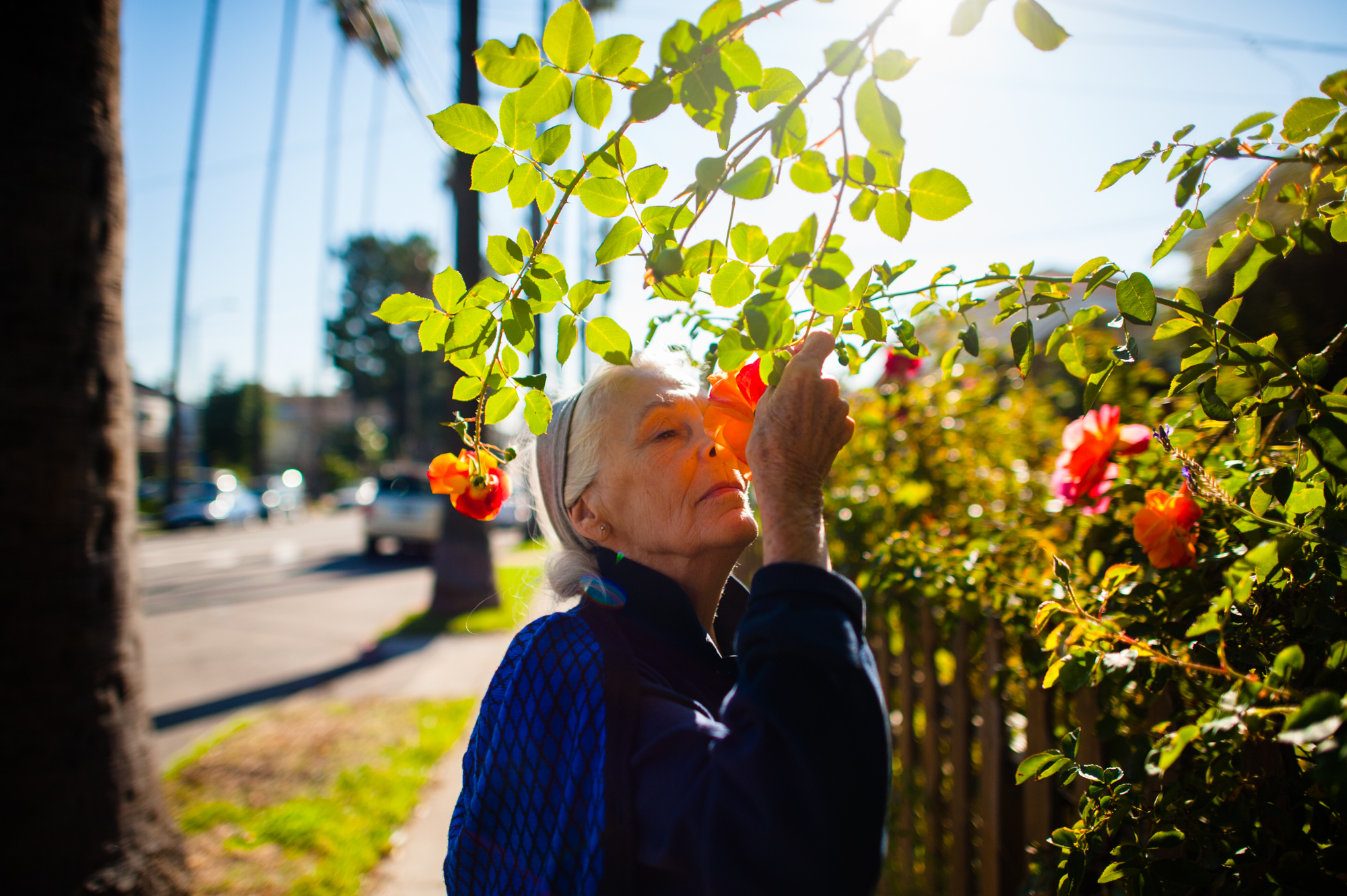  Jeanie smells roses.  