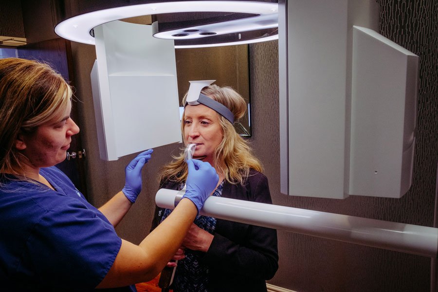 Patient and Nurse using CT Scanner