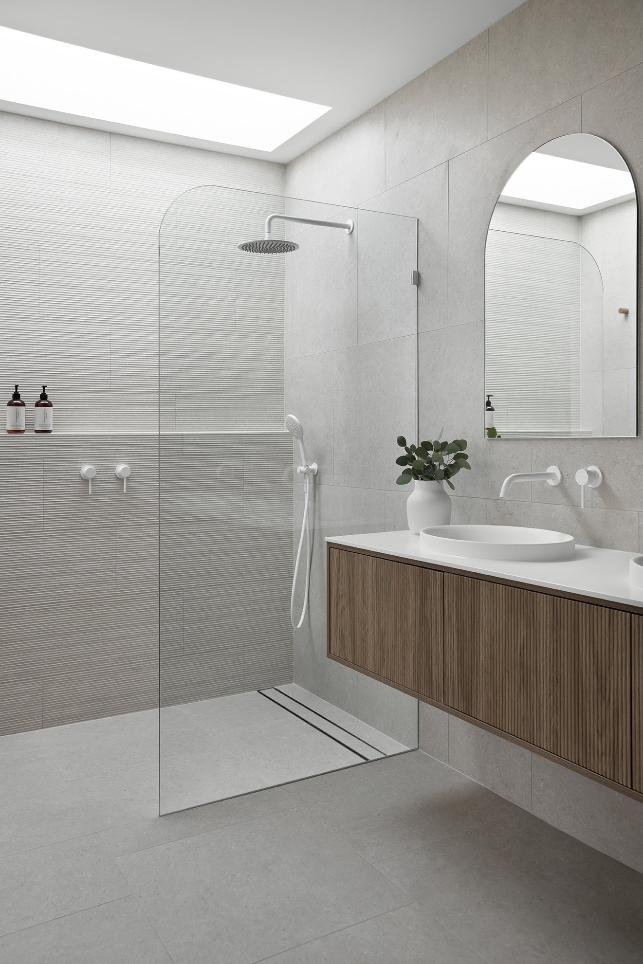 Coral House Ensuite with skylight shower screen with shower shelf and wall hung vanity for bathroom renovation