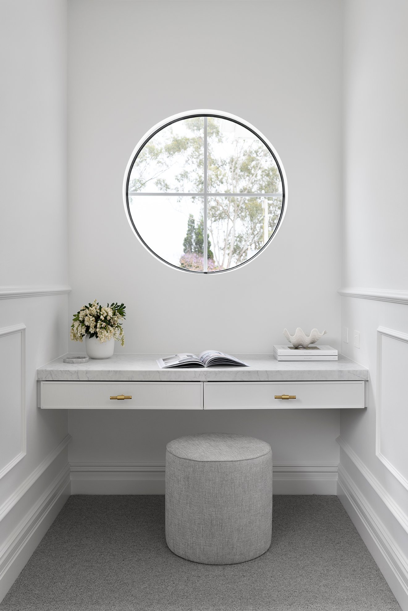 Wooden study desk with wheel window and cushion stool in Hamptons study nook design guide plan and colour scheme.